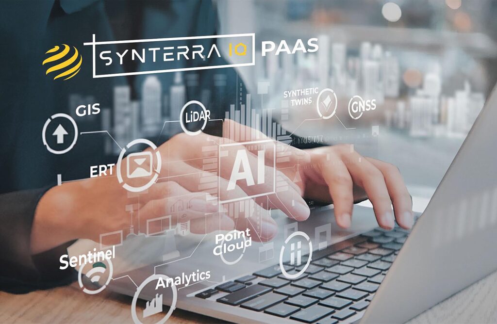 Person typing on a keyboard and the name SynTerra IQ appears to float above keyboard